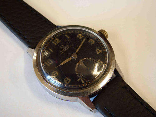Rare WWII Period Omega manual wind mens wristwatch with black dial, serial number 9464531