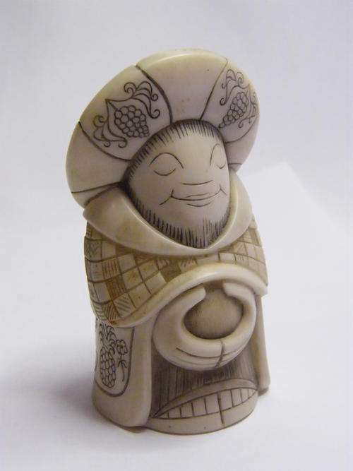 Faux Ivory Figurine - Content Man holding Belly - Small Chip on bottom - as per photo