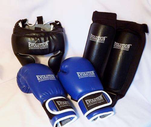 Set of Evolution Professional equipment boxing gloves, headgear and shin pads - as per photo