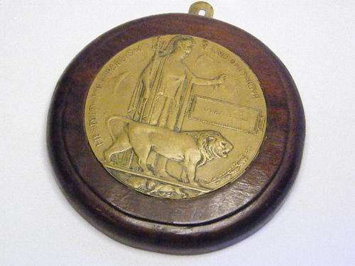 WW1 Death plaque of Harry Little set in wooden mount