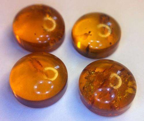 4 x 8mm round pieces of Amber with inclusions - sold as a lot - as per photo