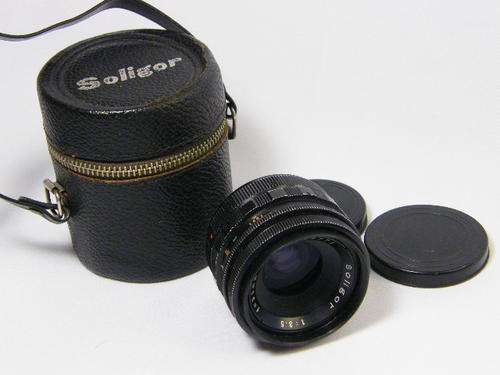 Soligor (for Minolta) 1:3.5 f  35 mm lens in holder - as per photo