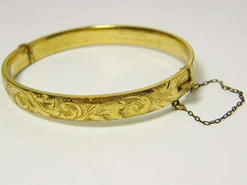 Rolled gold vintage bangle with safety chain - as per photo