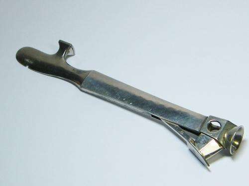 Vintage cigar cutter and pipe tool with silver sides - as per photo