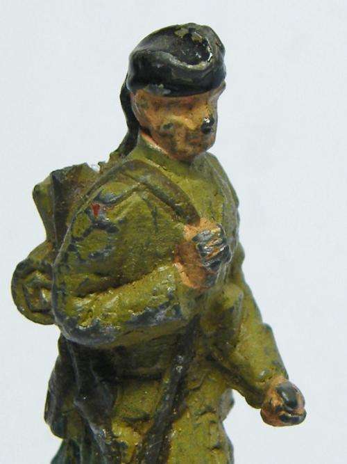 Vintage Scottish lead soldier hiking with kit and rifle - as per photo