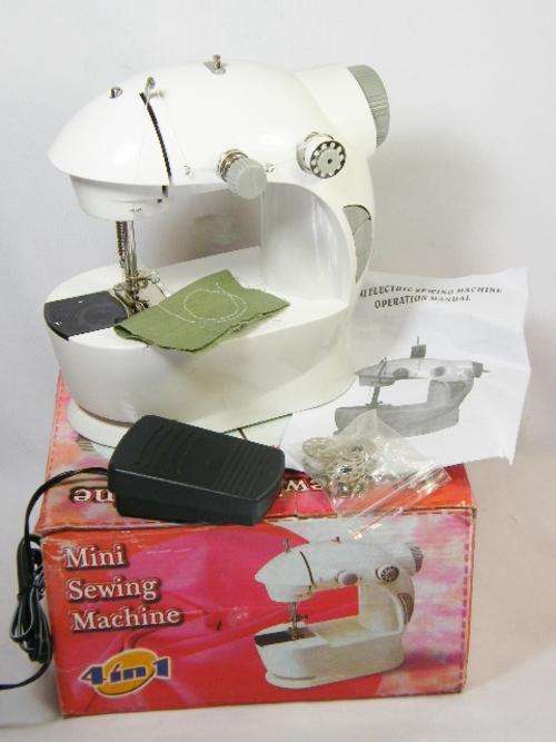 4 in 1 Mini sewing machine in original box - as per photo