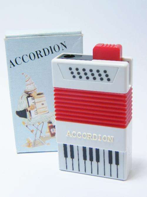 Vintage accordion shaped electric lighter in original box - not working - as per photo