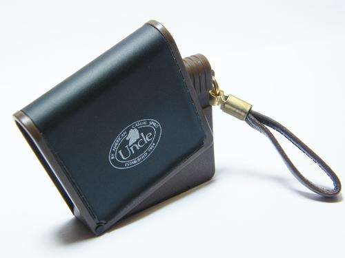 Vintage Uncle pouch shaped electric lighter - working - as per photo