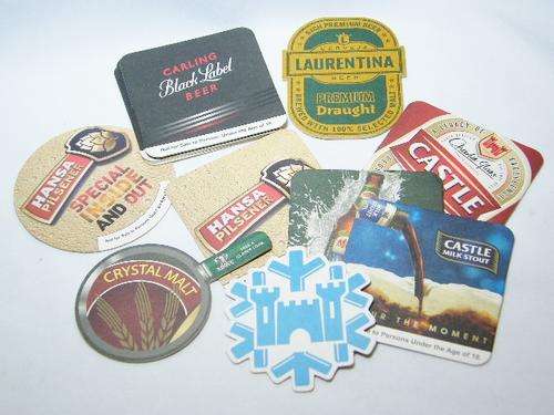 Lot of  beer coasters - different brands - some duplicates - 9 different ones - as per photo