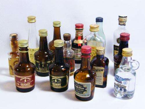 Lot of 15 vintage small liquor bottles - most are empty - as per photo