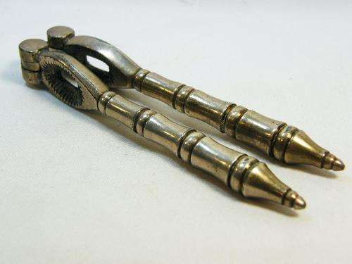 Vintage silverplated nutcracker with banded handles - as per photo