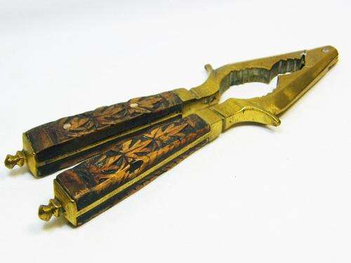 Vintage brass nutcracker with wooden handles - as per photo
