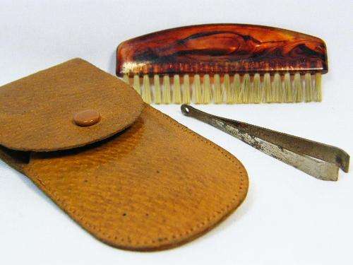 Vintage leather pouch with tweezers and comb - as per photo
