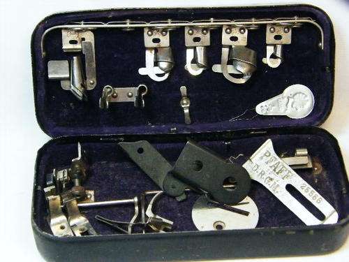 Antique Pfaff sewing machine attachment kit with parts - as per photo