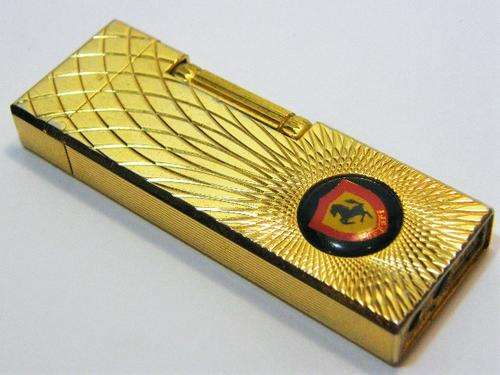 Vintage gold plated pocket lighter with Ferrari emblem - needs a flint - as per photo