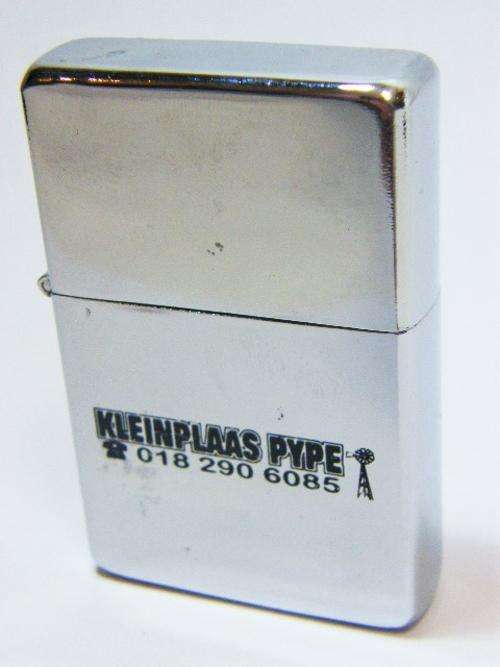 Champ stainless steel flip top lighter with Kleinplaas pype logo - working - as per photo