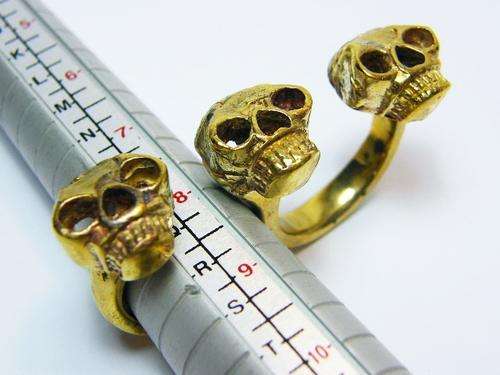 Triple skull brass knuckle buster ring - as per photo
