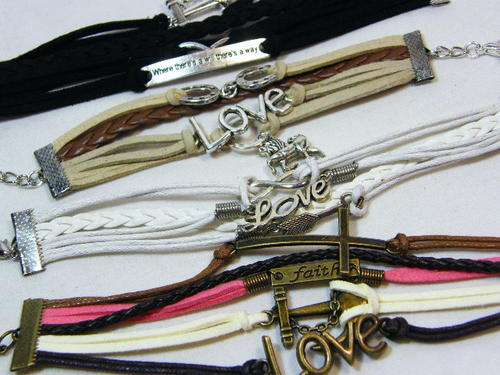 Lot of 4 leather fashion bracelets - as per photo