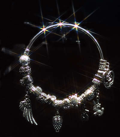 Pandora sterling silver plated, 66mm width solid bracelet with 15 charms