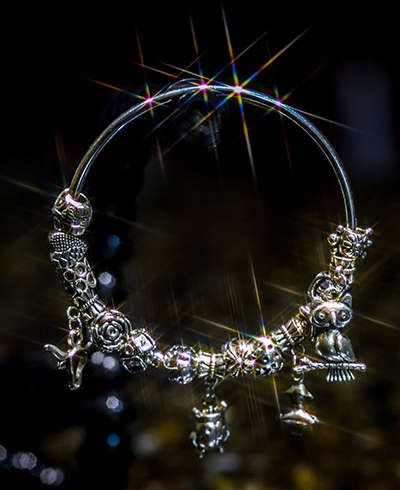 Silver plated, solid bracelet, 65mm width, with 14 charms
