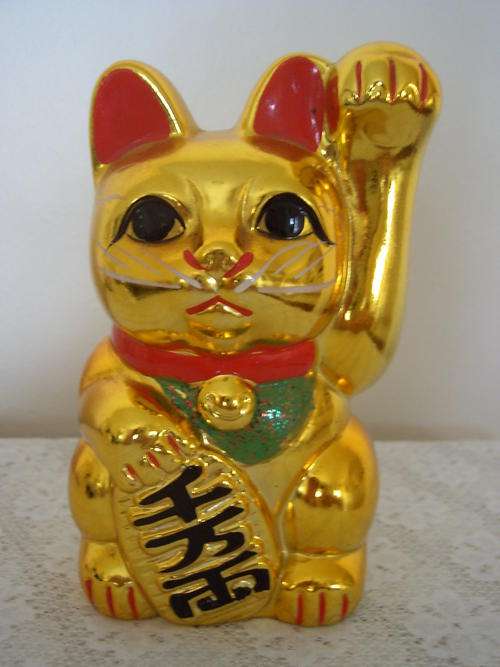 SAVINGS BOX FROM JAPAN. BRIGHT GOLD COLOUR. TOO UGLY FOR WORDS!!!!!