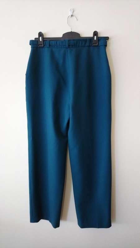 Teal green high-waisted trousers