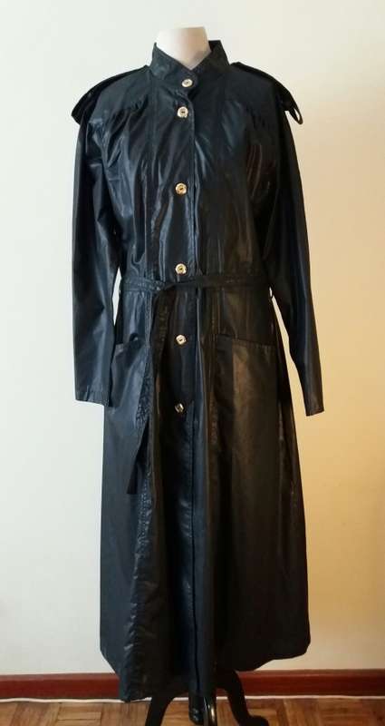 Long black raincoat with copper buttons