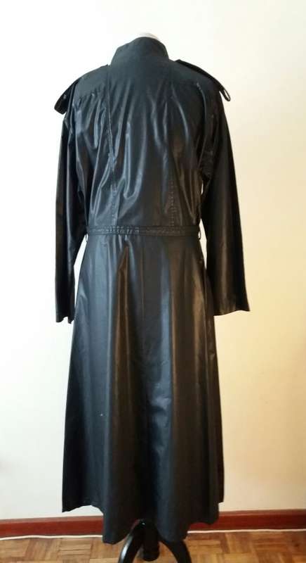 Long black raincoat with copper buttons