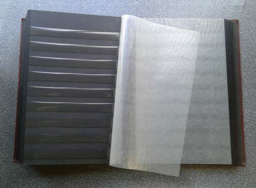AS NEW LOVELY KEK 16/32 PAGE STOCKBOOK. BLACK DOUBLE GLASSINE INTERLEAVES.