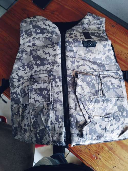 Paintball body armour with pod pack
