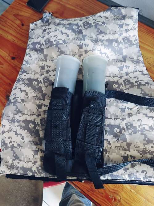 Paintball body armour with pod pack