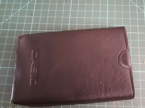 Vintage Casio personal digital organizer with manual