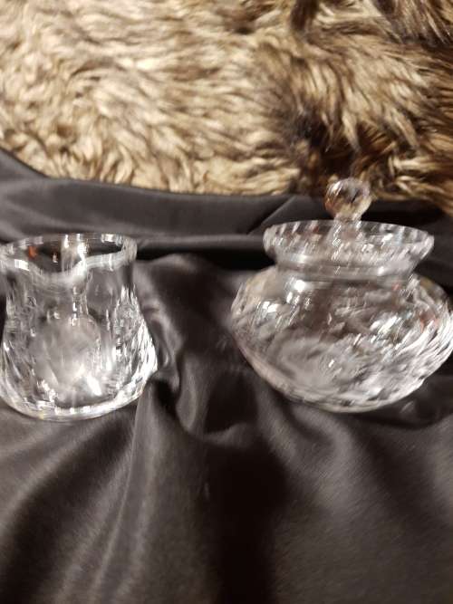 Set of fine cut crystal lidded sugar bowl and milk jug