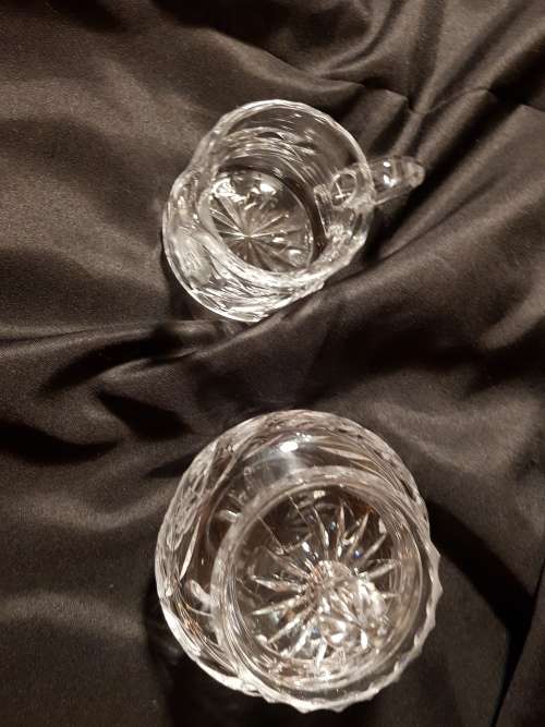 Set of fine cut crystal lidded sugar bowl and milk jug