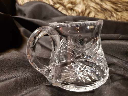 Set of fine cut crystal lidded sugar bowl and milk jug