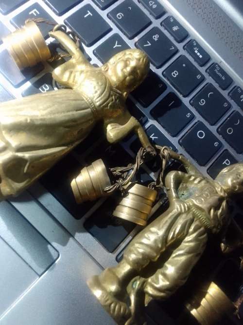 2 solid brass male and female figurines from Belgium.