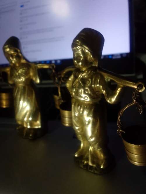 2 solid brass male and female figurines from Belgium.