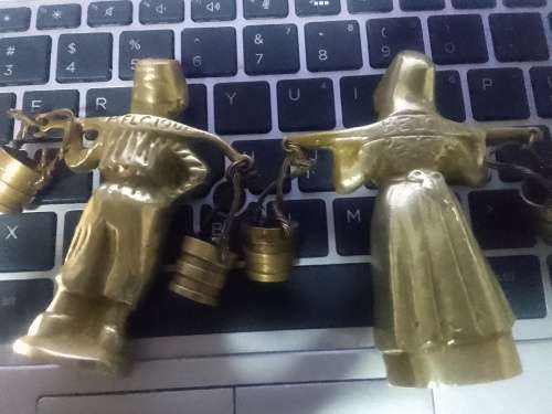 2 solid brass male and female figurines from Belgium.