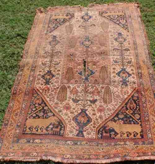 WORN OUT OLD HAND WOVEN CARPET - A BEAUTY IN ITS DAY NOW A REMNANT OF OLD PERSIA - CHARACTER PIECE!