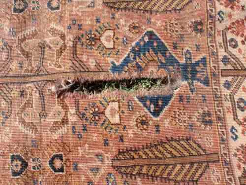 WORN OUT OLD HAND WOVEN CARPET - A BEAUTY IN ITS DAY NOW A REMNANT OF OLD PERSIA - CHARACTER PIECE!