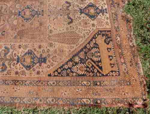 WORN OUT OLD HAND WOVEN CARPET - A BEAUTY IN ITS DAY NOW A REMNANT OF OLD PERSIA - CHARACTER PIECE!