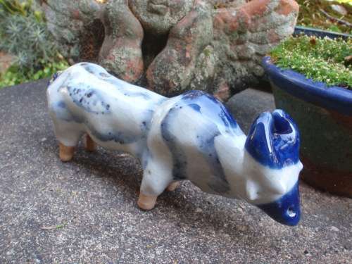 WONDERFUL and ARTY POTTERY CATTLE - BLUE DRIP GLAZED WITH HAND PAINTED DESIGNS - UNIQUE