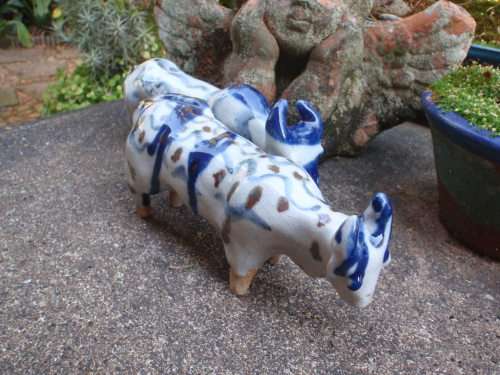 WONDERFUL and ARTY POTTERY CATTLE - BLUE DRIP GLAZED WITH HAND PAINTED DESIGNS - UNIQUE