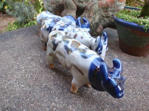 WONDERFUL and ARTY POTTERY CATTLE - BLUE DRIP GLAZED WITH HAND PAINTED DESIGNS - UNIQUE