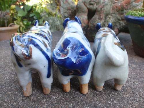 WONDERFUL and ARTY POTTERY CATTLE - BLUE DRIP GLAZED WITH HAND PAINTED DESIGNS - UNIQUE
