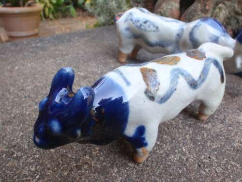 WONDERFUL and ARTY POTTERY CATTLE - BLUE DRIP GLAZED WITH HAND PAINTED DESIGNS - UNIQUE