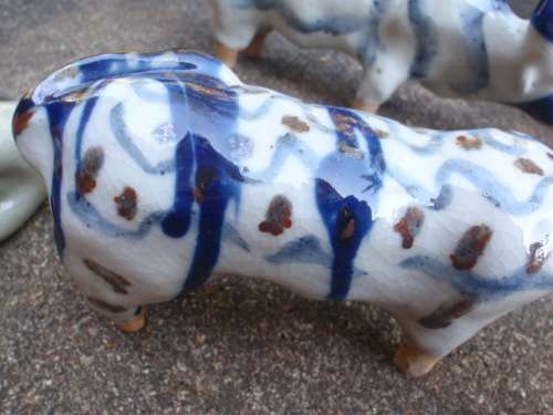 WONDERFUL and ARTY POTTERY CATTLE - BLUE DRIP GLAZED WITH HAND PAINTED DESIGNS - UNIQUE