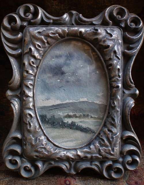 Original watercolour in heavy ornate pewter style frame - lovely character piece.