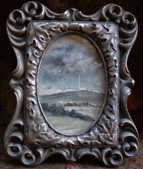 Original watercolour in heavy ornate pewter style frame - lovely character piece.