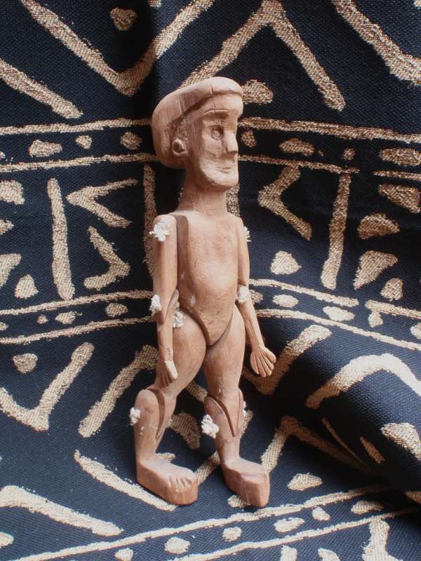 African wood carving by well known Bethwell Mahlaba - jointed limbed figure. Signed on each foot.